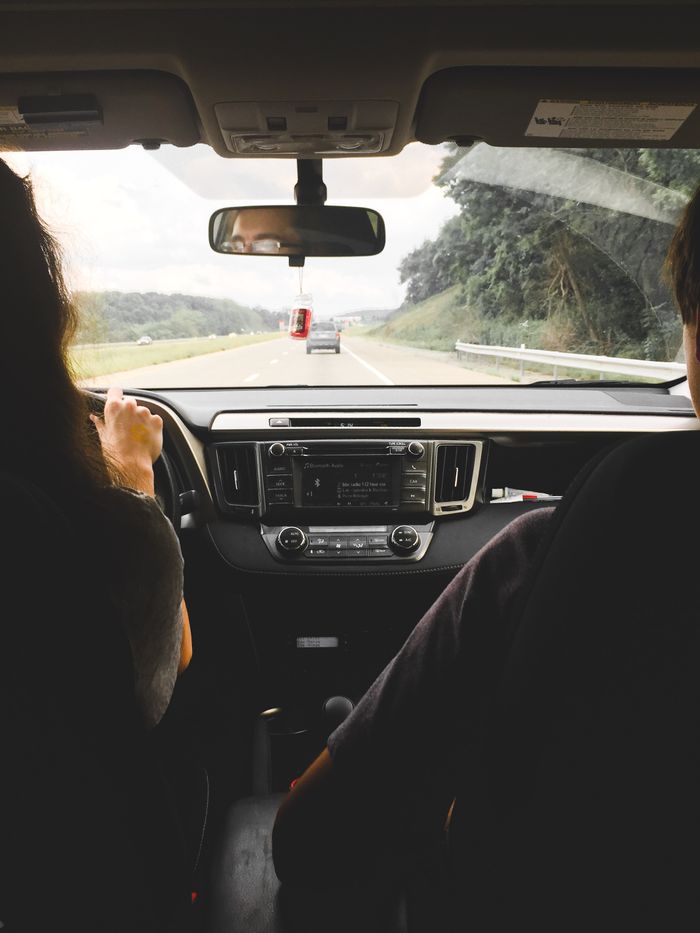 Mastering the First Impression: Your intriguing post title goes here View from inside a car showing passengers looking out at an open highway, emphasizing travel and journey.