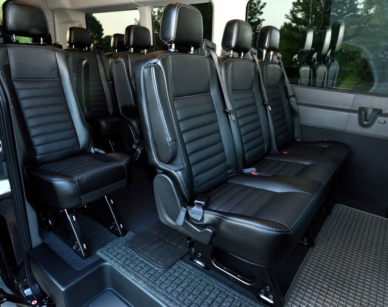 Crafting Captivating Headlines: Your awesome post title goes here Luxurious black leather seating inside a spacious minivan with ample legroom.